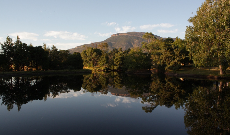 Mt William, the highest mountain of the Grampians National Park, refected in the waters of Blue Lake at Grampians Paradise Camping and Caravan Parkland